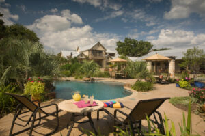 Relax by the pool at our Granbury Hotel, surrounded by beautiful gardens.
